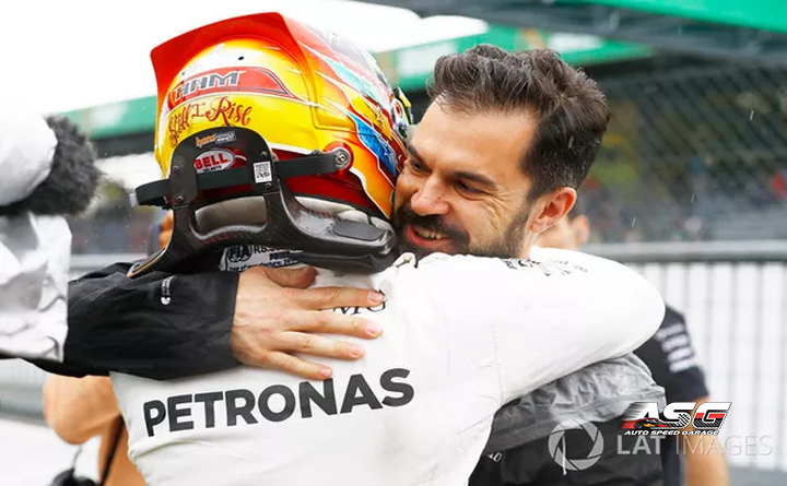 Lewis Hamilton, Mercedes AMG F1, celebrates, Marc Hynes after taking his 69th F1 Pole Position